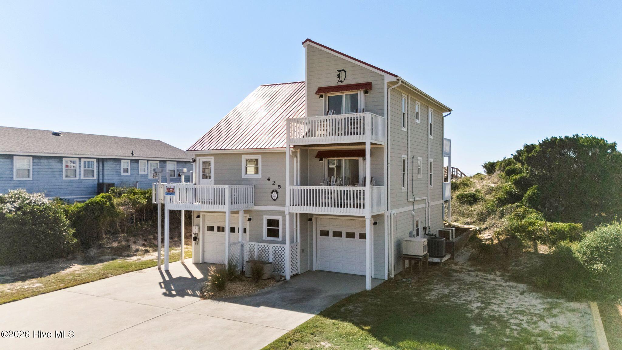 Photo 3 of Single family home for sale at 425 Caswell Beach Rd, Oak Island, NC 28465 | MLS# 100611200 | Listing updated on 2026-10-21