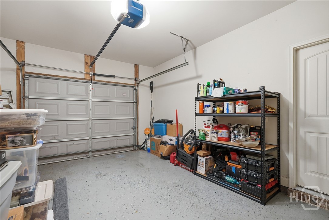 One-car garage is large and features a floor finish.