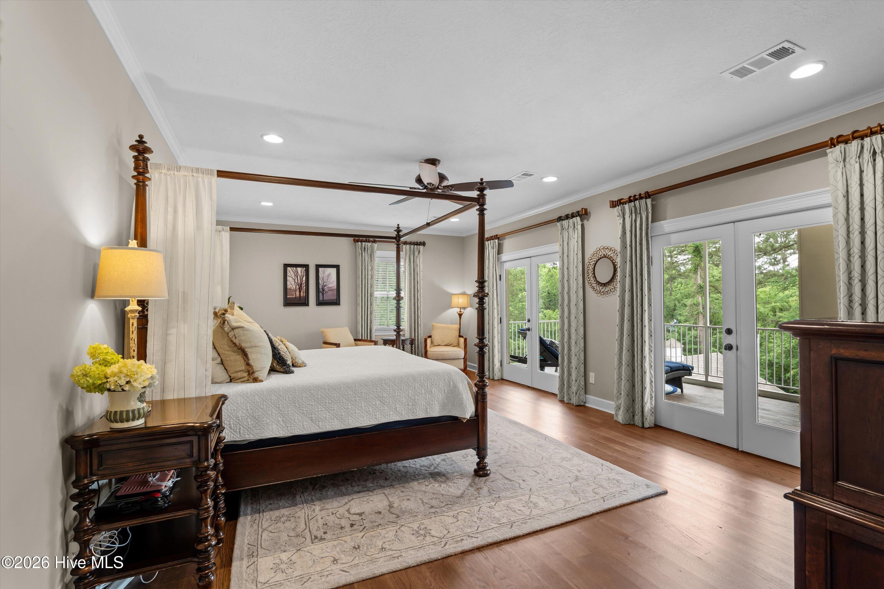 Master bedroom with double French doors to screened porch