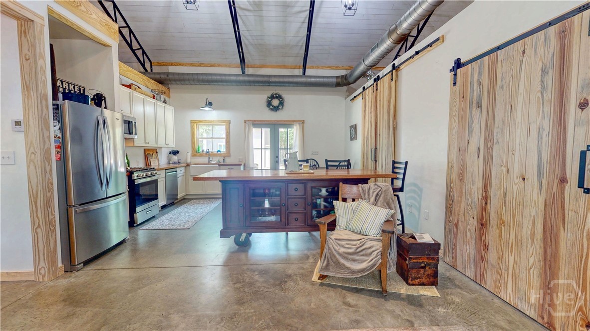 Walking toward the kitchen area.