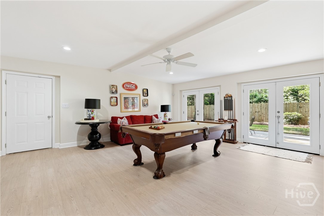 Entertainment room with 2 sets of french doors