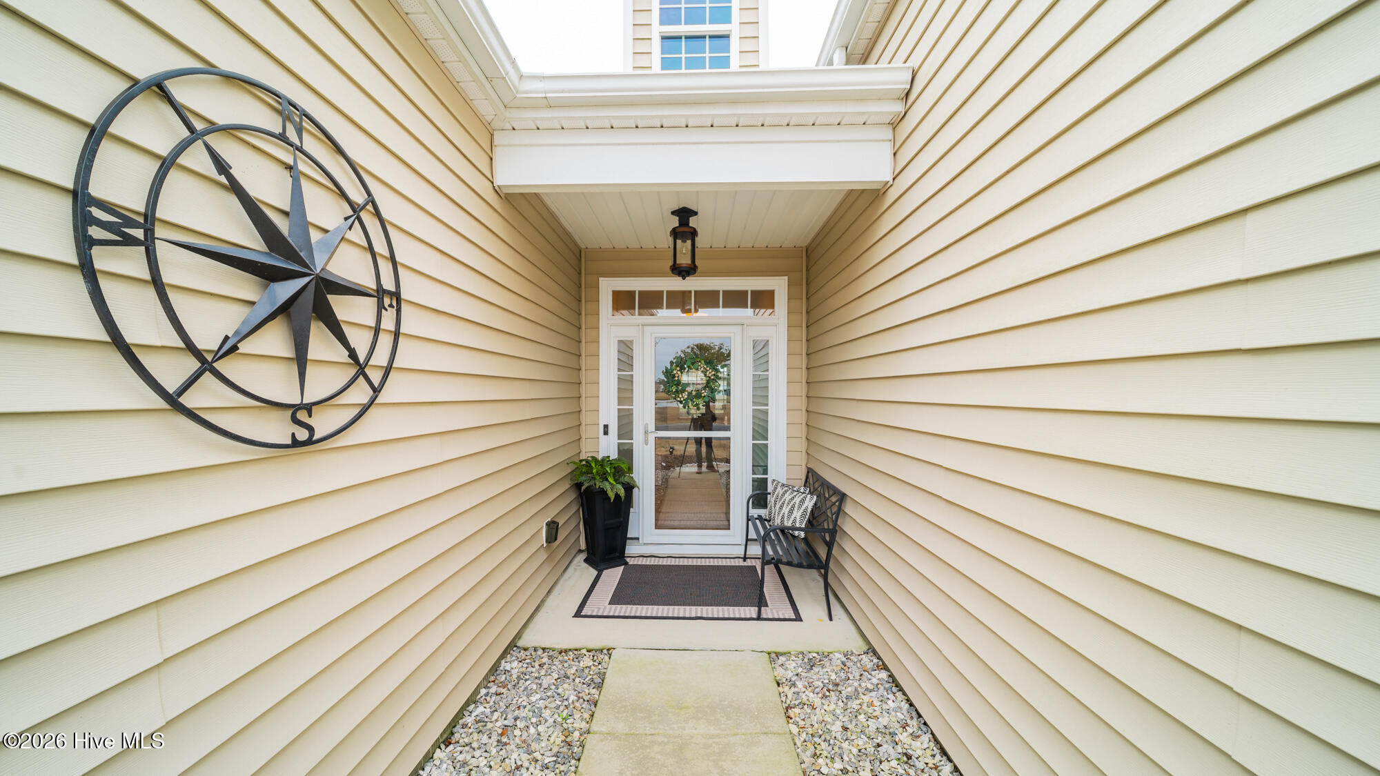 Sheltered entry that is large enough for a small bench