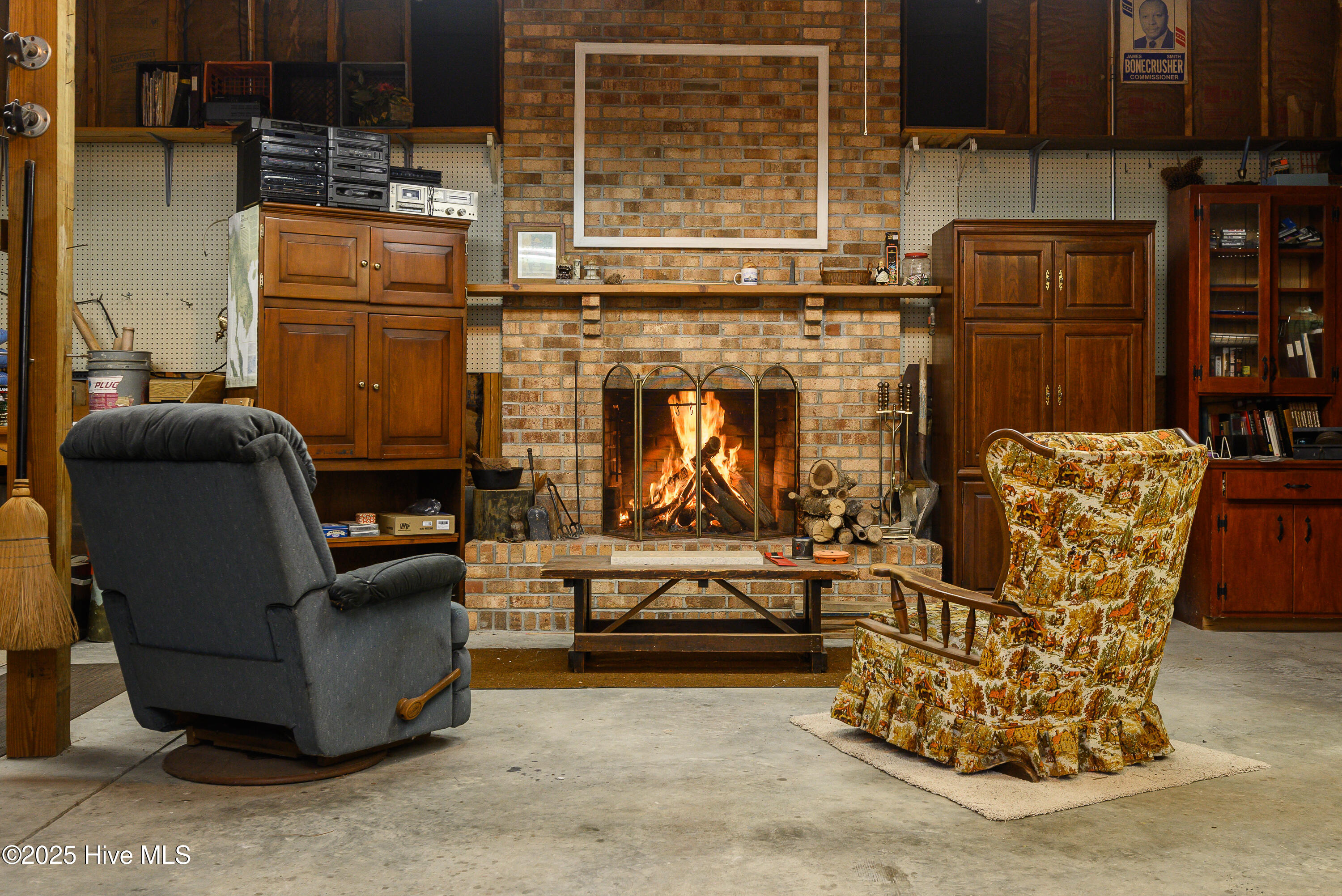 Wood burning fireplace in bay one of three in the secondary garage.