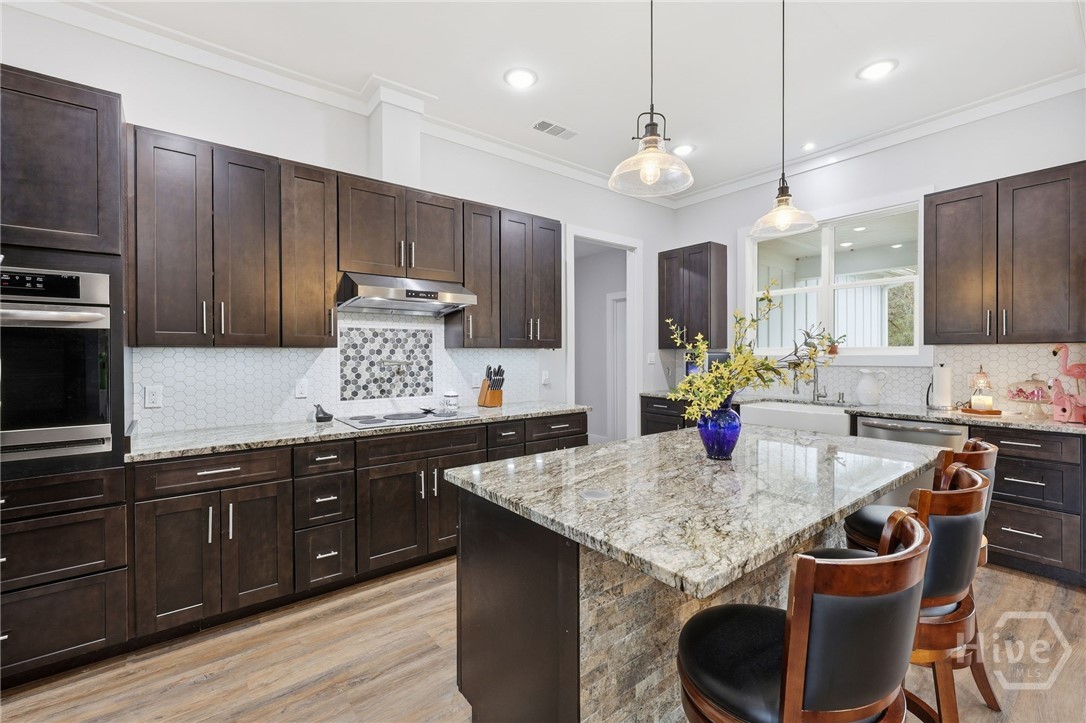 Granite countertops & serving bar with hidden microwave