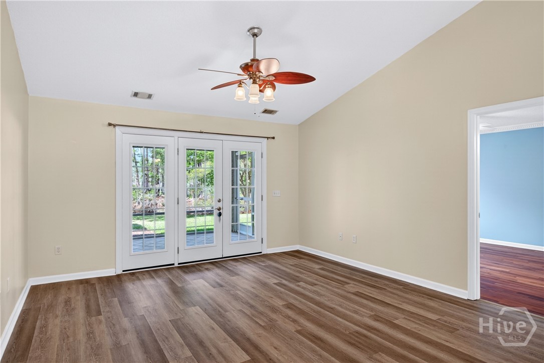 Standing in the dining area/living room with your back to the pass through kitchen window. Master bedroom entrance to your right. Screened porch through the door.