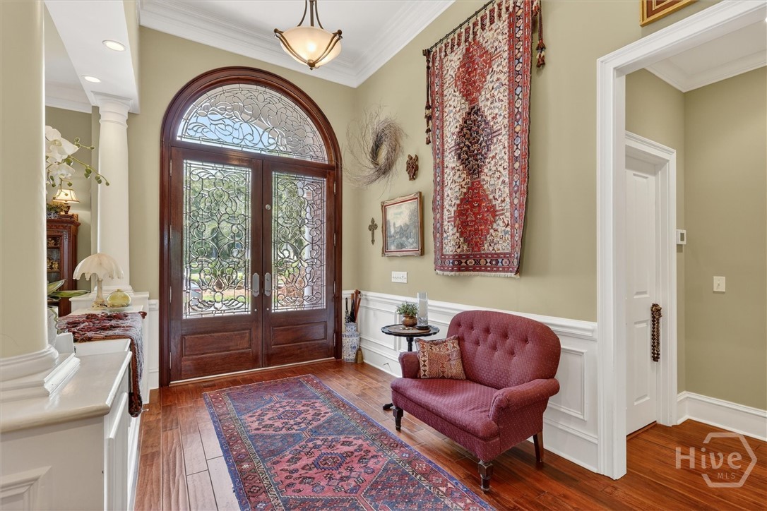 Gorgeous leaded glass double doors create quite th