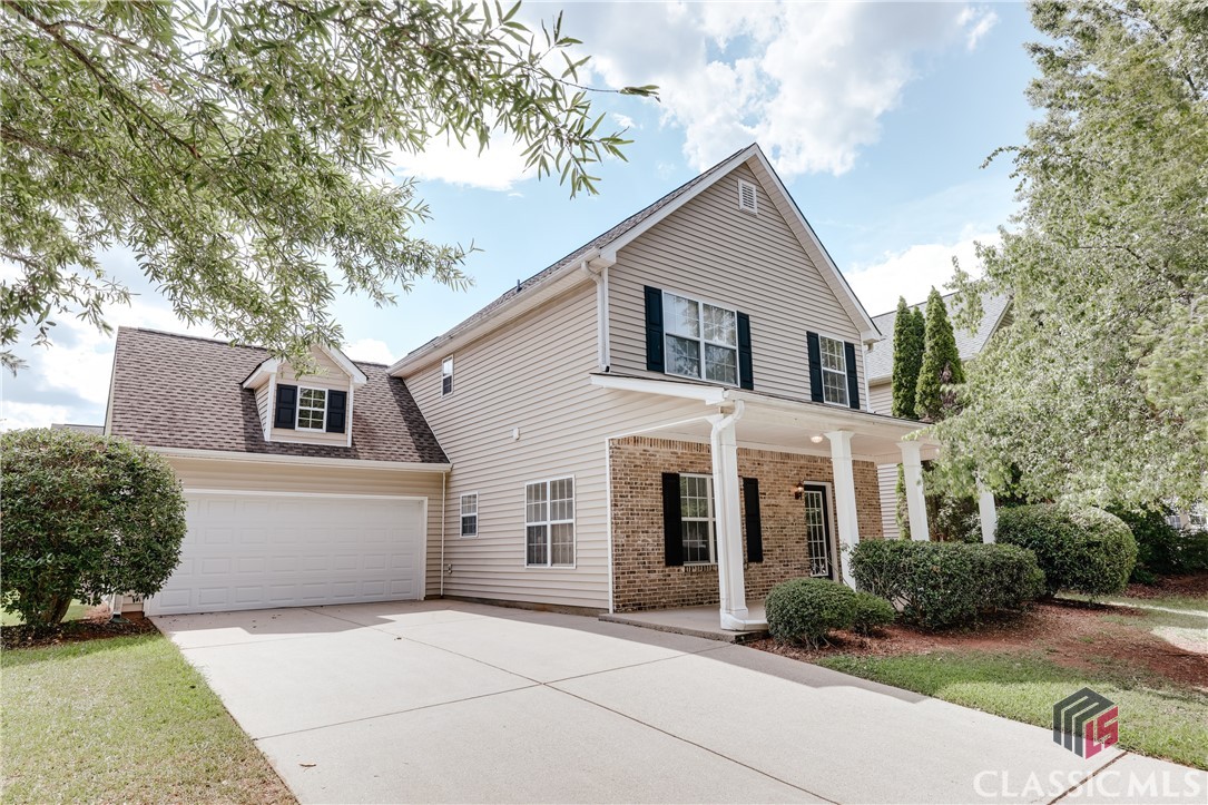 Welcome to 154 Blake Way in the convenient Millford Hills neighborhood. This stunning 3-bedroom, 3.5-bath home features a unique floor plan with double-height ceilings in the living room and an open layout in the social areas. Upon entering, you'll be greeted by abundant natural light. To the left, a versatile flex room can serve as an office, sitting area, or extra bedroom.The practical kitchen offers a clear view into the living room, complete with a striking fireplace. The main level also includes a spacious primary bedroom with an ensuite bathroom. Upstairs, the hallway provides a great view of the living room below. Two additional bedrooms with vaulted ceilings and two full bathrooms complete the upper level.The large backyard, accessible from the living room, offers a perfect, private, fully fenced area to enjoy Georgia afternoons with friends and family. A generous concrete patio provides ample space for a grill, table, and chairs. Garden beds are ready for growing seasonal veggies and herbs.Freshly painted, with new LVP flooring throughout, this move-in-ready home offers exceptional value. Close to the Vet School, Athens Montessori, and a short drive to shops and restaurants on the East side. Schedule a private tour and make 154 Blake Way your own!