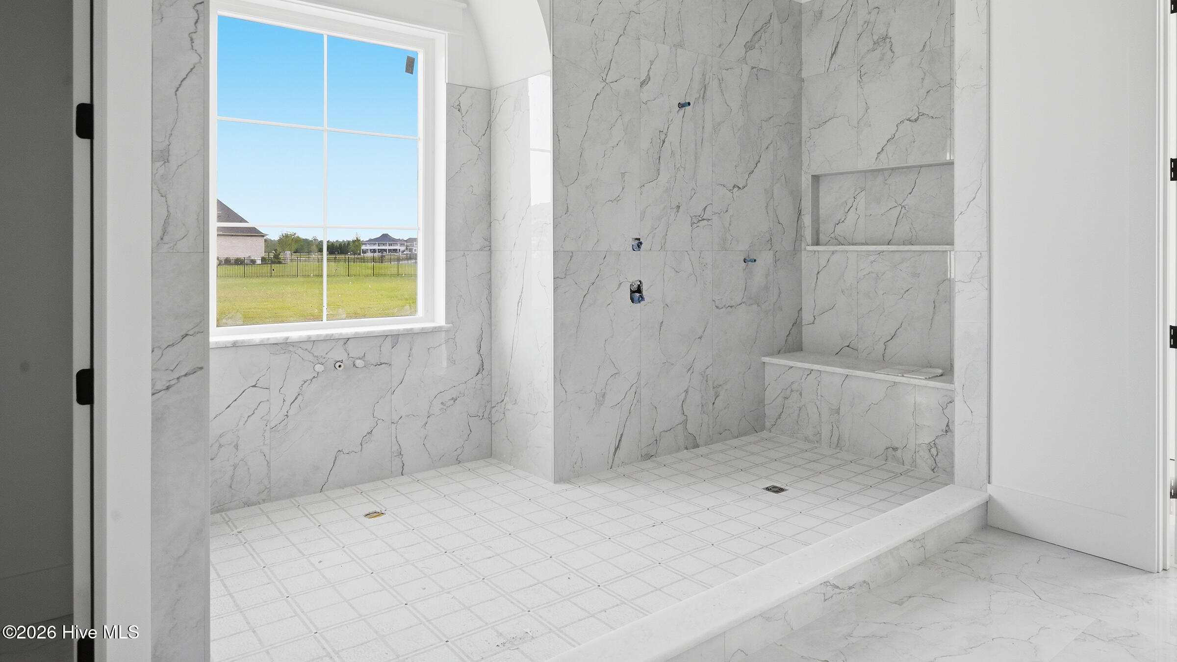 the all inclusive wet room will have a stand alone tub at window and elaborate shower setting enclosed with glass .. stone and tile work is most impressive !