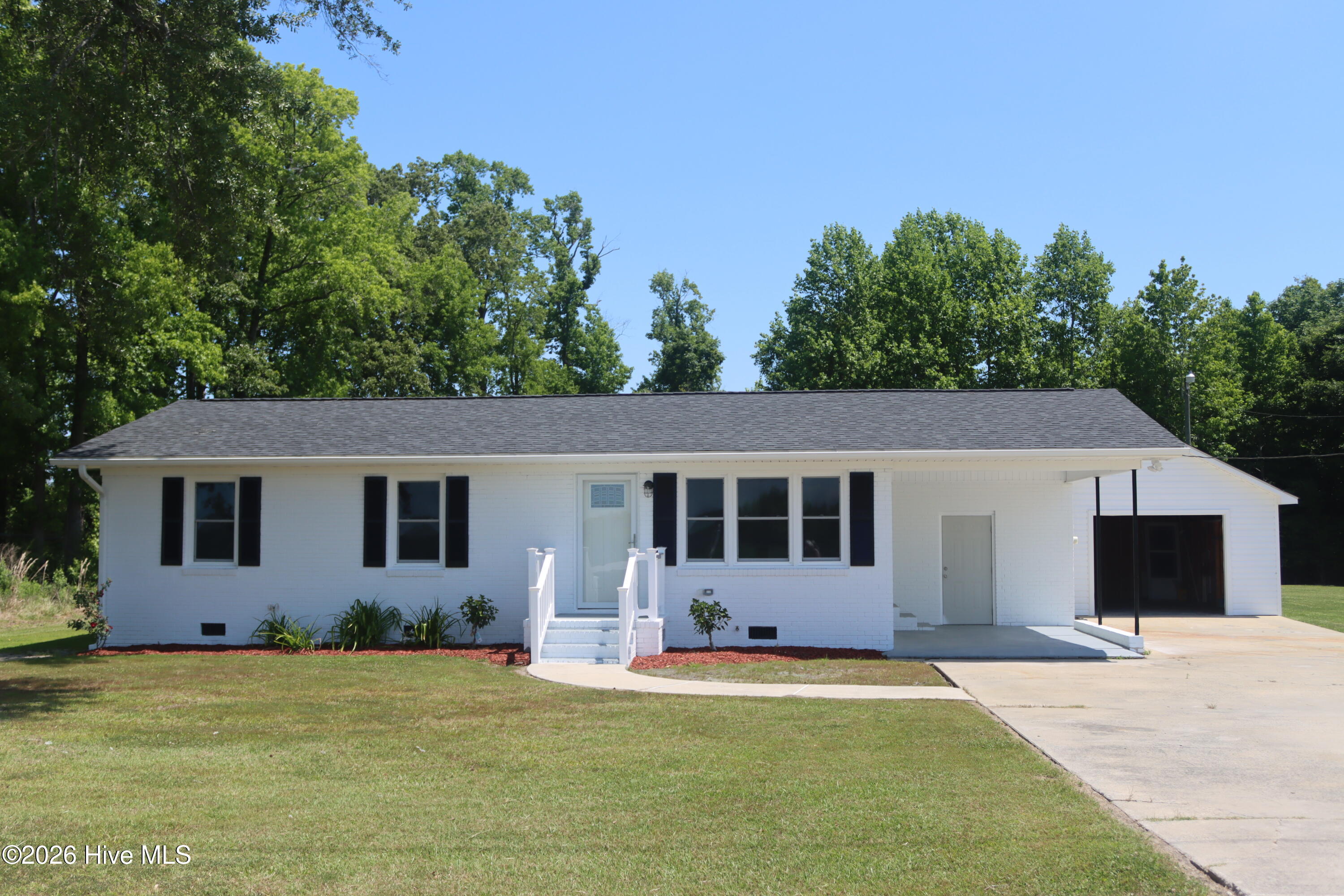 Adorable 3 bedroom 1 bath home on .90 acre unrestricted property. Two detached garages adjoin a circular driveway allow for car parking and storage. This home has been completely remodeled.from top to bottom. New roof, windows, doors, LVP flooring, kitchen and bath. Upgraded electric, plumbing. New HVAC. You are a quick drive to Bayboro and Grantsboro for shopping dining and doctors office.The attached carport could be screened for an outdoor porch