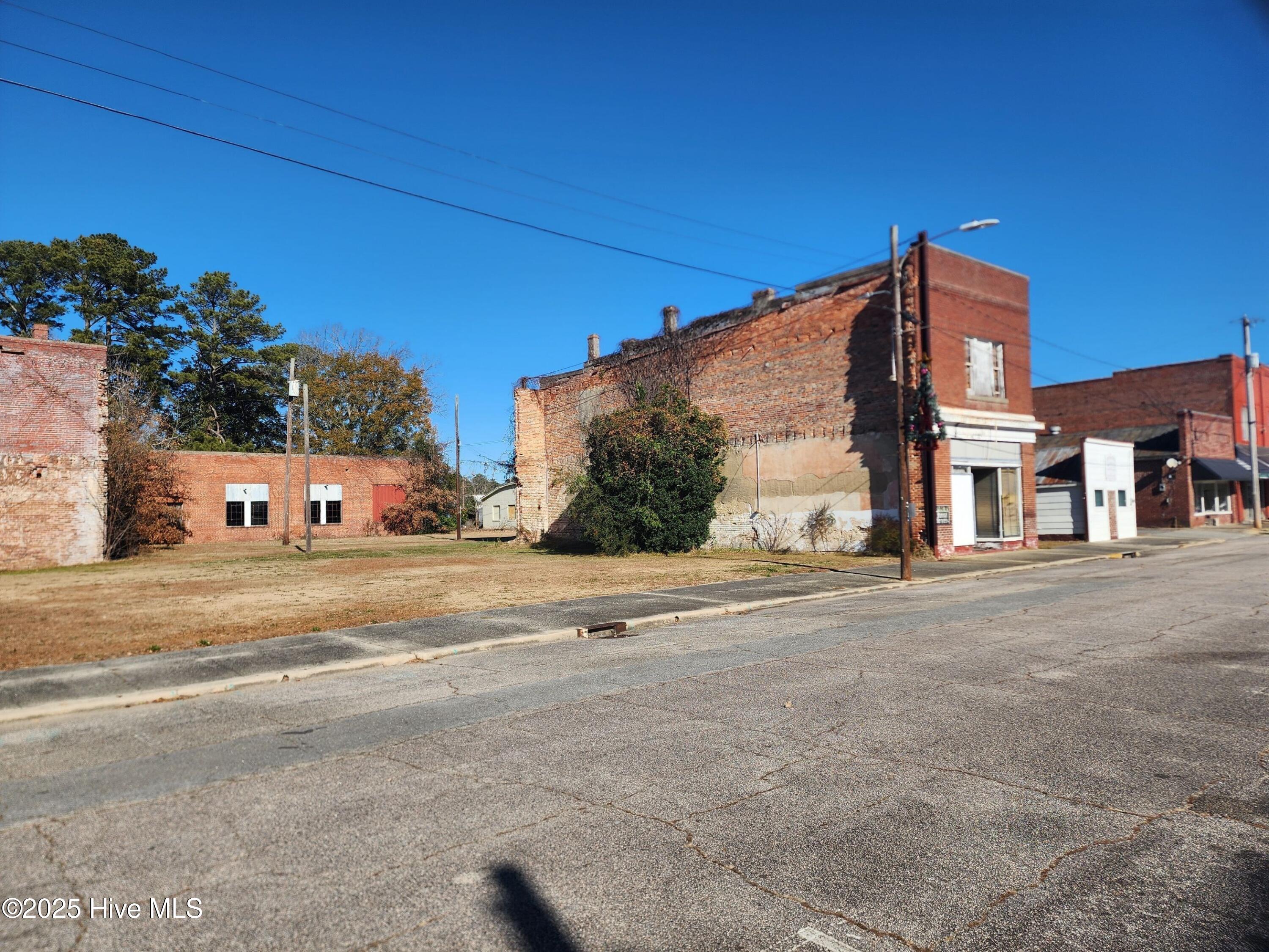 This exceptional property package in downtown Robersonville NC includes five parcels totaling approximately 0.6 acres, which includes one building offering approximately 1,740 square feet of versatile space.
Included in sale
102 N. Main Street, PARCEL ID 0700148
104 N. Main Street, PARCEL ID 0701154 
108 N. Main Street, PARCE   ID 0700150
110 N. Main Street, PARCEL ID 0700169
104 E. Railroad St,  PARCEL ID 0700149
Seize the chance to invest in or expand your business with five commercial properties located in the heart of Robersonville, North Carolina. Situated in Martin County, Robersonville appears to offer a unique blend of small-town charm and affordability. Robersonville is approximately  22 miles from Greenville, NC.
Greenville-Pitt County is centrally located in eastern North Carolina, serving as the cultural, educational, and economic hub of the region. As a vibrant university town, it offers a unique blend of urban amenities and small-town charm. With a population of approximately 89,233 according to the latest U.S. Census estimates, Greenville is the largest city in the region, strategically positioned to serve over 815,000 people within a 45-mile radius.
Nestled just inland from the North Carolina coast, Greenville is located east of I-95. The city spans 39.09 square miles, while Pitt County covers 656.52 square miles. The area is situated in the north-central coastal plains of Eastern North Carolina, approximately 85 miles east of Raleigh, 87 miles west of the Atlantic Ocean, 157 miles south of Richmond, VA, and 265 miles from Washington, D.C.
Greenville is known for its abundant green spaces, with more than 30 parks throughout the city and county. Whether you're exploring the great outdoors or enjoying the city's artistic and cultural offerings, there's always something to experience. Greenville's art galleries, museums, and lively festivals are a testament to the community's creative spirit.
