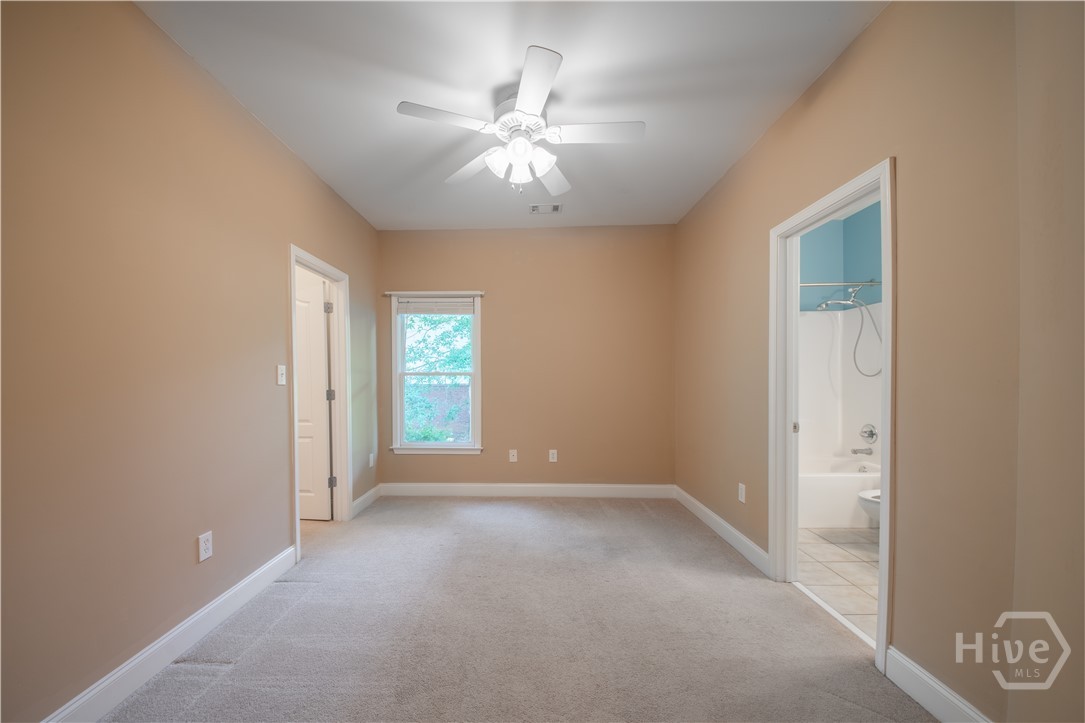 Secondary Suite - Bedroom 4 and Bathroom off the Kitchen and next to Stairs