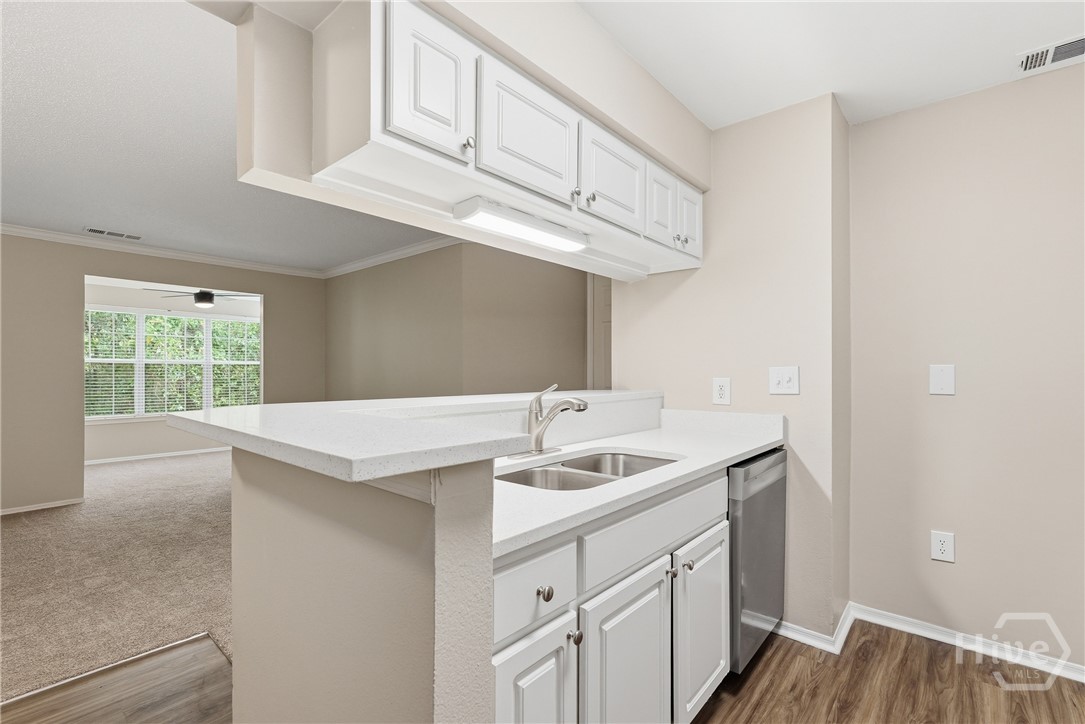 Kitchen Overlooks Living Room and Sunroom!