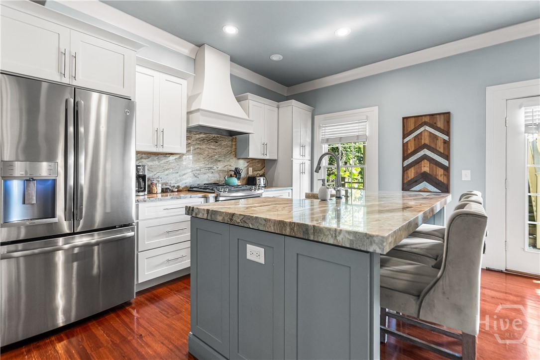 The dining room opens to the stunning kitchen.