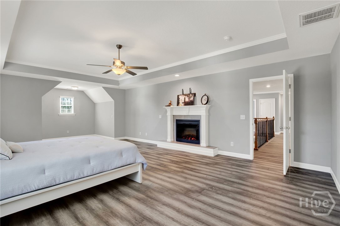 Expansive Primary Suite with Sitting Area and Fireplace