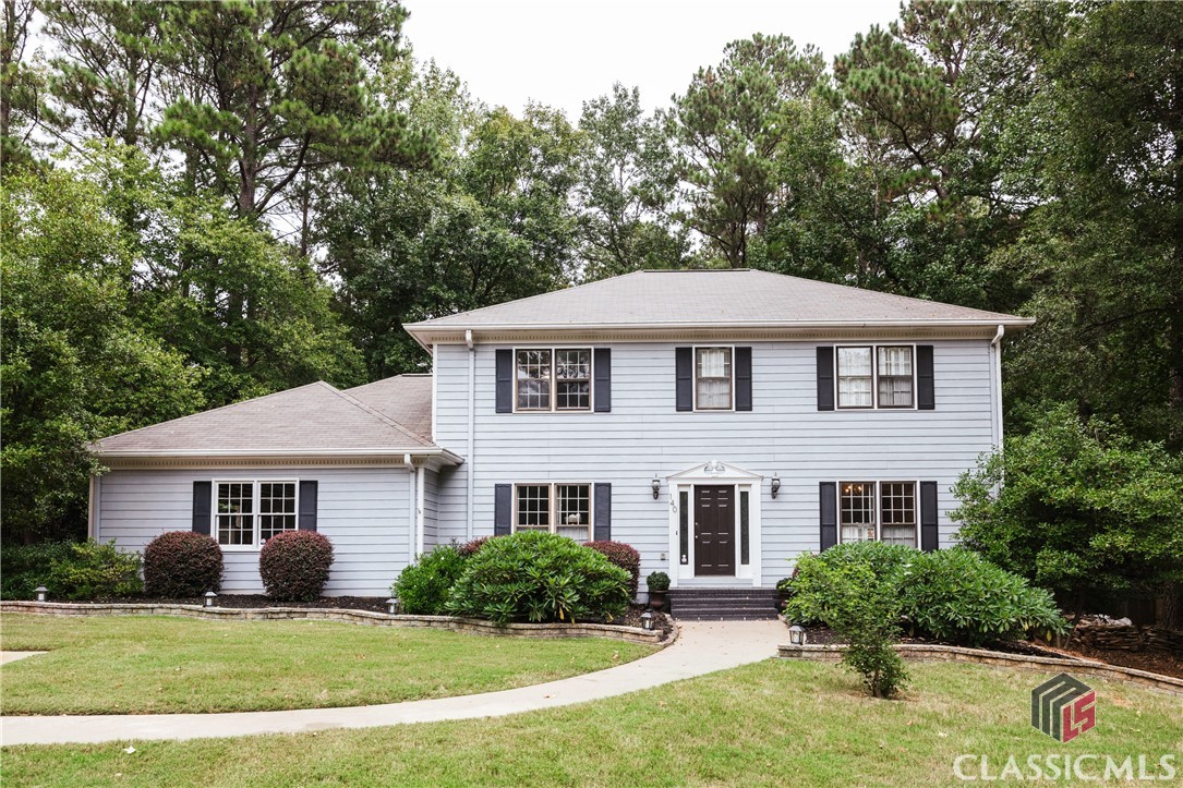 This lovely home is sited on a large lot with beautiful mature landscaping in the highly desirable High Ridge neighborhood, centrally located and convenient to all things Athens. Highlights include: an open floorplan on the main floor, with large kitchen with abundant storage and counter space, eat-in kitchen dining nook with bay window views of lush landscape within privacy fenced backyard. The living room features a fireplace flanked by built-in bookcases/storage, and a wall of tall windows/doors that provide views of backyard sanctuary, and open to a huge multi-tier deck and courtyard, perfect for quiet meditation or entertaining. Adjoining the living room is a large formal dining room with lovely chandelier and cloaked in abundant natural light. Additionally, there’s a flex room/office, a very large laundry/storage room, and half bath on the 1st floor. Upstairs there are 4 BRs, 2 baths, including an impressively large master suite. Additional highlights include parking for 6, with a 2 car garage, a privacy fenced back yard, a storage shed, artful pathways of stone and brick, thoughtful landscape design, and an impressive 2-tier deck which integrates well with the interior common living area. The current owner has made numerous updates over last several years, including new roof 9-2022, rebuilt and recently painted deck, 2 new HVAC systems, new hot water heater in 2024, new stove, bidet feature added to toilets, walk-in Koehler shower, exterior paint, landscaping/hardscaping. This property has been lovingly attended too, and awaits its new caretaker.