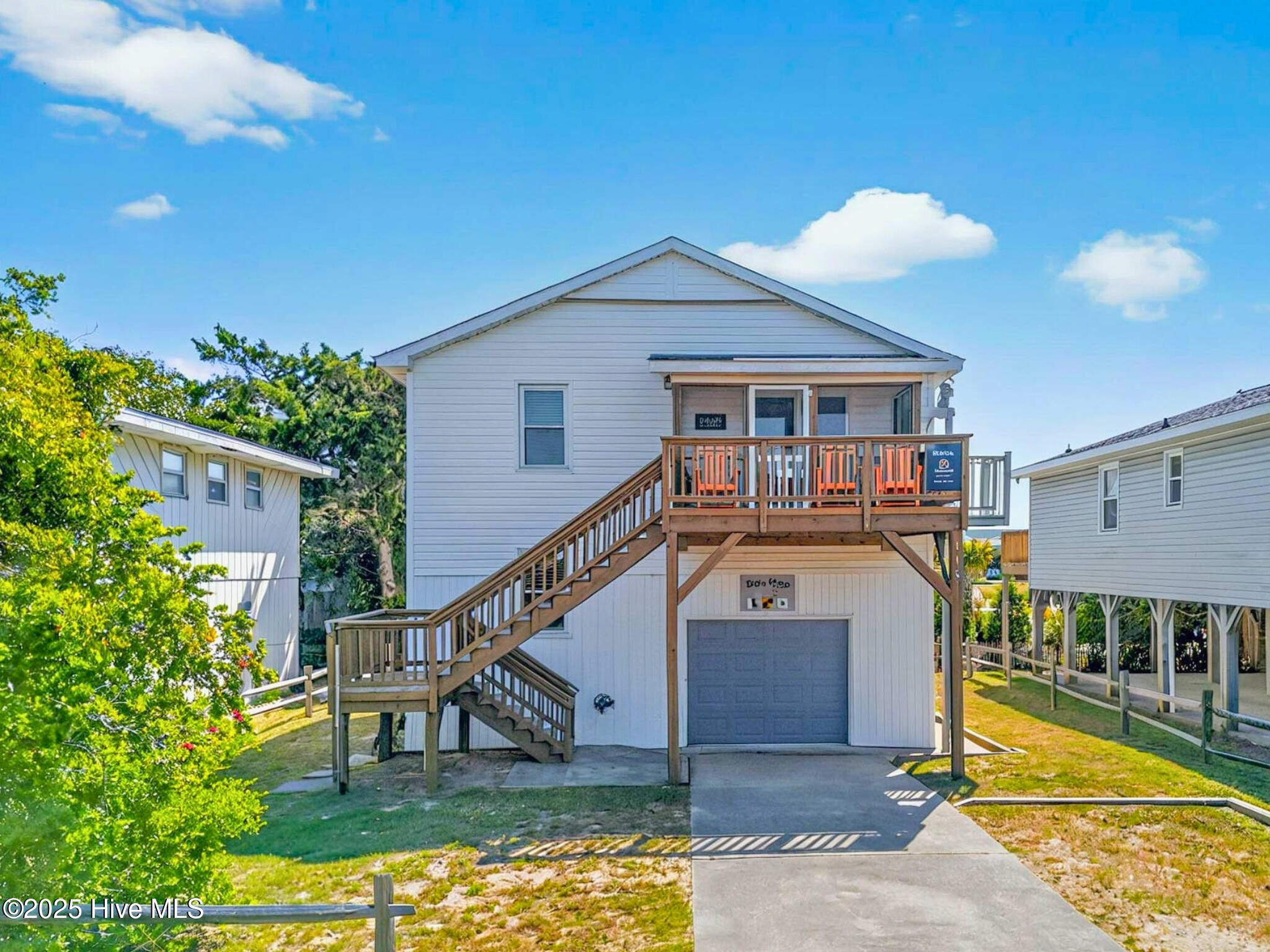 Perfectly positioned on the island's west end, this beautifully updated island home offers ocean, Intracoastal Waterway, and salt marsh views along with exclusive access to a private beach entrance reserved for Seaside Street residents - located just seven homes away.The well designed floor plan provides excellent functionality across two levels. On the first level you'll find two bedrooms including a bunk bed area plus a large bedroom and a shared full bathroom. The second floor features the spacious main living area, modern kitchen, two additional bedrooms, and a shared bathroom along with access to the front and back porches.The updated kitchen showcases granite countertops, a functional peninsula, ample cabinet storage with under-cabinet lighting, and a custom built-in bench for dining. Adjacent is a screened porch with water views, perfect for coastal breezes and al fresco dining. The living room opens to an additional screened porch and front deck, offering peaceful outdoor spaces.Practical amenities include an exterior lift for easy luggage transport, a spacious hot/cold outdoor shower, and an oversized garage with abundant storage. Recent updates include a roof replacement (2020 fortified roof) and HVAC update (2022), ensuring worry-free ownership.The home's cul-de-sac adjacent location ensures privacy with no rear neighbors. Situated on a quiet street with a mix of full-time residences and vacation homes, the property enjoys quick access to local restaurants, shopping, fresh seafood markets, the public boat launch near Holden Beach Bridge, and championship golf courses just minutes away.With its privileged beach access just a short walk away and premium finishes throughout, this turnkey property delivers the ultimate coastal lifestyle as an investment property, second home, or year-round residence.