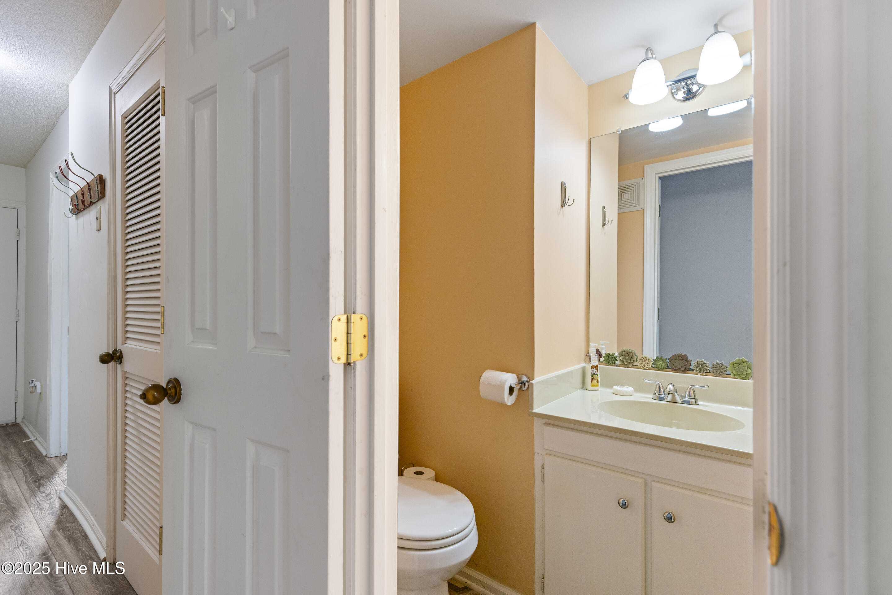 1908 Goose Creek Road SW Unit 1202, Ocean Isle Beach, NC 28469 – photo 22: Hallway Half Bathroom