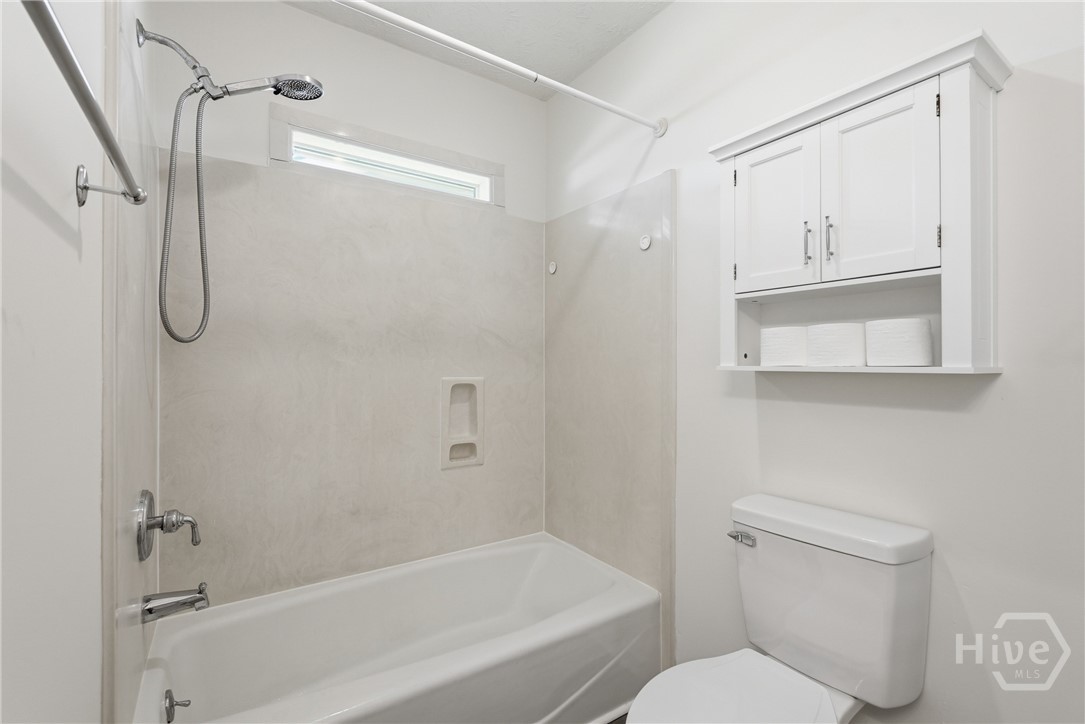 Hall bathroom features a tub and shower.