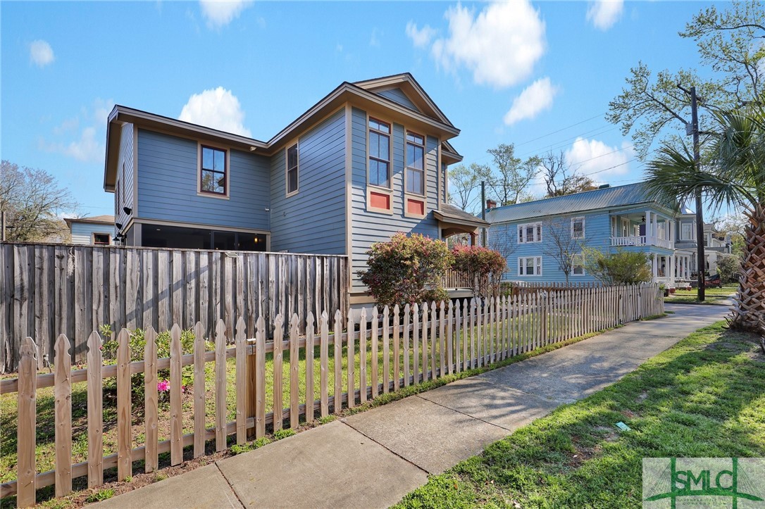 screened in porch with see through fireplace on le