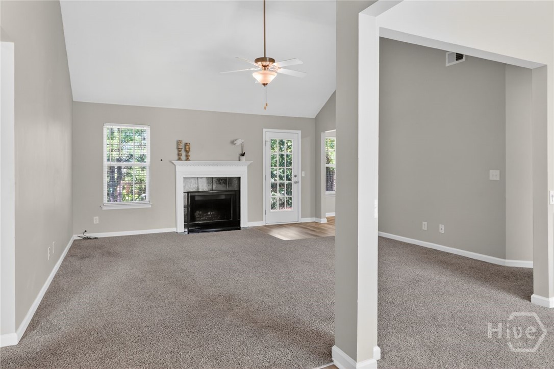 Family room with fireplace and vaulted ceiling