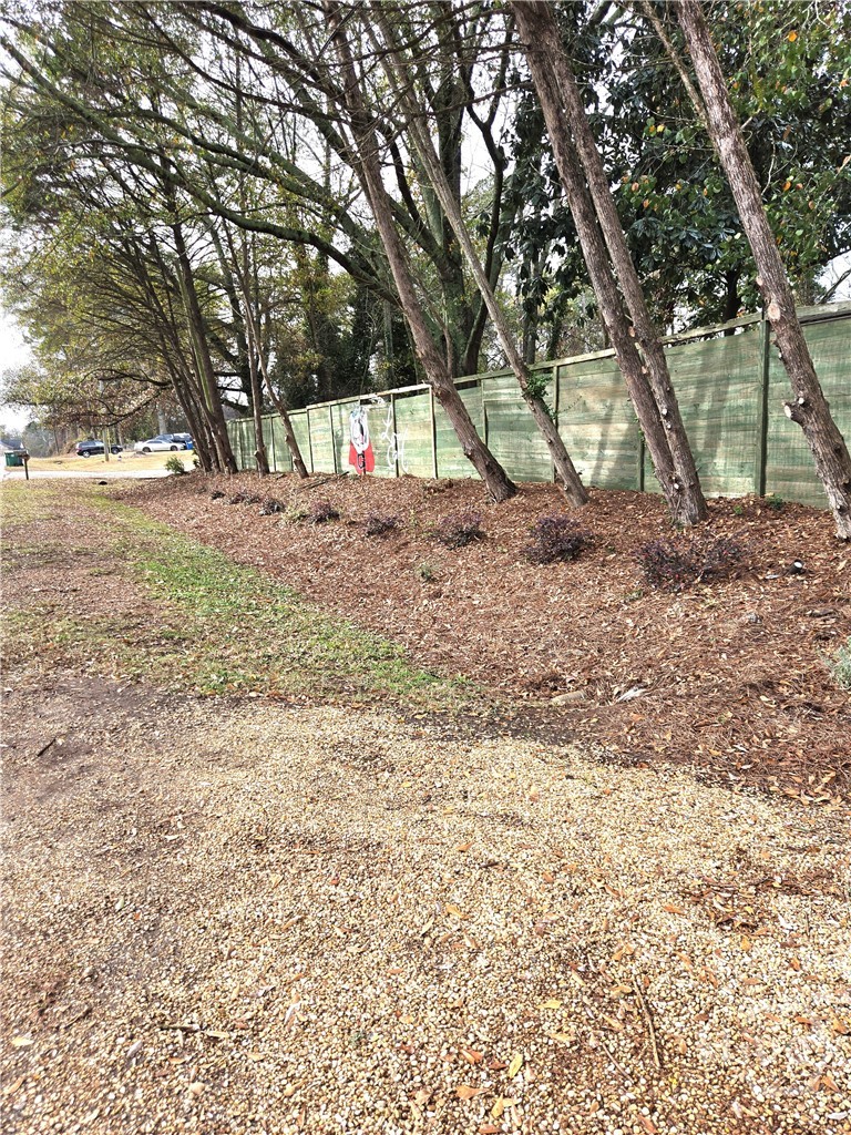 Front yard and fence view from Riverbend.