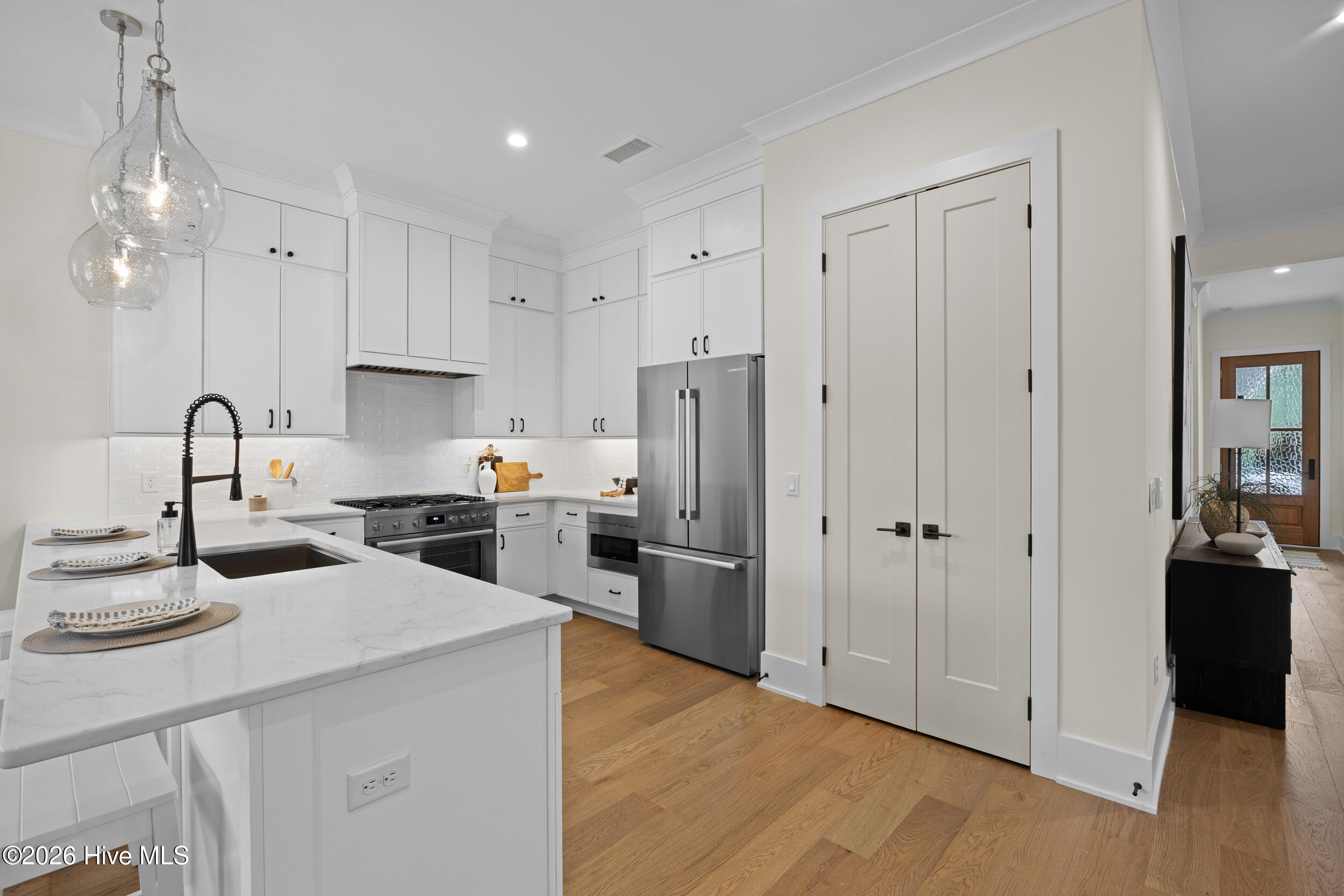 Kitchen with dishwasher, quartz counter tops, natural gas oven