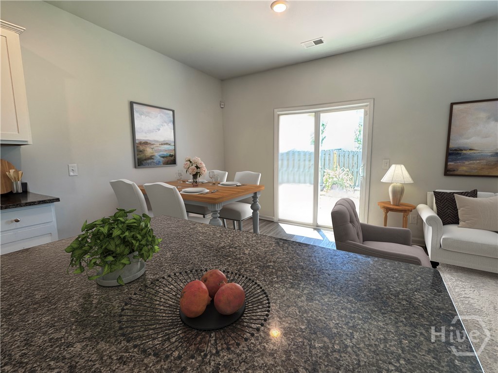 Virtually Staged Breakfast Area overlooking Backya