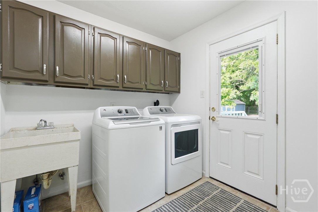 A separate laundry room flows to the back yard and