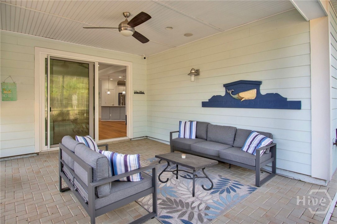 Custom paver enclosed porch leads to the pool
