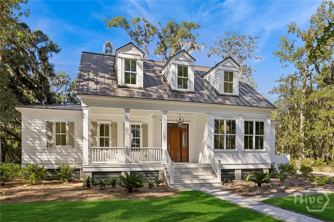 Tucked along the picturesque, oak-lined streets of the Cherry Hill enclave, this Lowcountry cottage captures the timeless beauty and easy elegance that define life at The Ford Field & River Club. Just 20 minutes from historic Savannah, the home features 3 bedrooms, 4 full baths, and a dedicated office. Inside, custom trimwork and marble-tiled baths showcase exquisite craftsmanship, while the spacious great room opens to a screened-in porch made for Lowcountry living. The gourmet kitchen boasts Thermador appliances, a full scullery with an icemaker, and a flexible dining space. Set on one of the largest corner homesites in Cherry Hill, just steps from the clubhouse and Lake Dye Grill. Builder is offering $50,000 toward the first full year of club dues—a rare chance to enjoy Southern elegance and exclusive Ford living from day one.