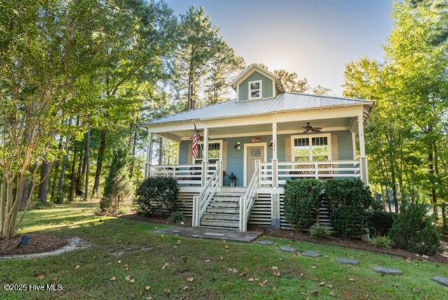 1044 Mill Creek Road Minnesott Beach, North Carolina Nestled at the end of the cul de sac, this creek cottage will bring relaxation and comfort. Located in the beautiful, waterfront subdivision of Arlington Place on the Neuse River. Currently serving as a short term rental but could also be a full time residence. Fully furnished with a gorgeous coastal interior and heart pine floors in the living areas. New flooring in first floor bedrooms and baths. New vanities in the baths as well. The outdoor setting will call for you with the screen porch and fire pit area with views of the creek and gorgeous sunsets. There is also the possibility of a kayak dock. Next door you will find the outfitters center which has a large outdoor fireplace for gatherings, kayaks and community dock. This community is for outdoor living and lifestyles. Some amenities include clubhouse, pool, tennis courts, basketball court, beach and additional community dock. boat ramp walking trails and more. There is also a golf course less than 10 mins away. Boat to New Bern for lunch or dinner. Minutes from Oriental and close to the Cherry Branch ferry which will lead to the beaches of the Crystal Coast and Beaufort NC. Conveniently located to Camp Sea Gull, Seafarer, Caroline and Don Lee. There is also an opportunity for an additional lot to build a second cottage on 1049 Mill Creek. Just ask for more details.