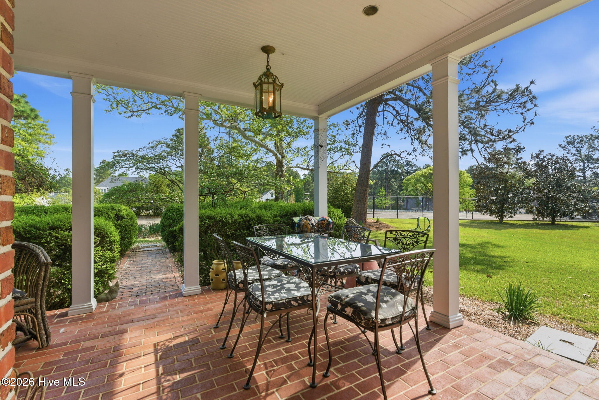 Side porch off kitchen with views of the grounds