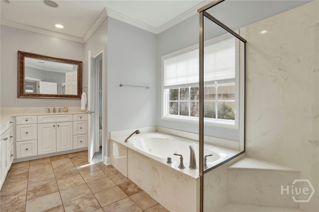 Primary Bathroom with separate step in shower and garden tub