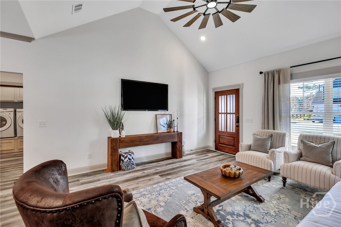 PHOTOS OF A PREVIOUSLY BUILT BRINSON PLAN BY LAWRENCE ALEXANDER HOMES.
