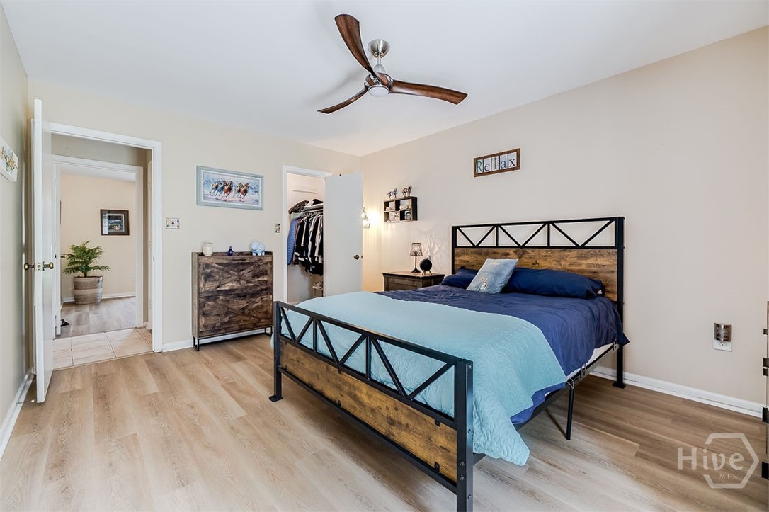 Primary bedroom has new LVP flooring and cool ceiling fan, this room is 14'7 X 11'5