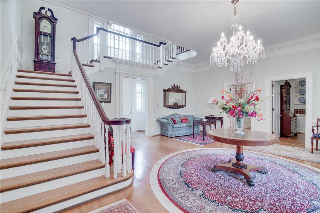 Foyer featuring Waterford crystal chandelier