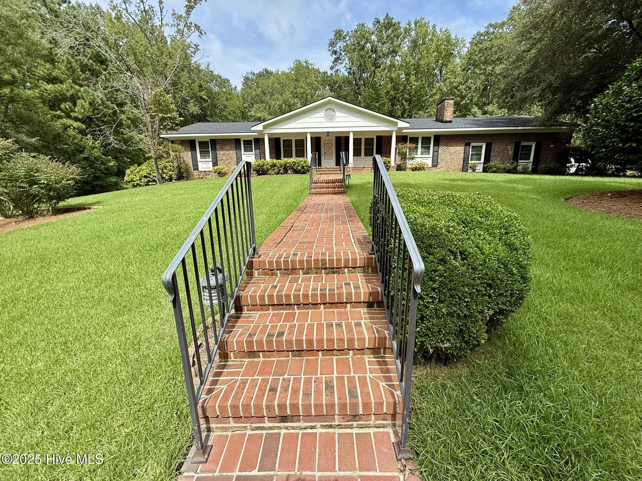 STEP INTO ELEGANCE & TIMELESS CHARM with this Glowing Home featuring an Expansive Open Floor Plan including a Committed Fam. Rm/Den w/Brick FP, Nice Wall Display w/Bookshelves & Cabinet Storage.  Lg. Kit. w/Open & Flowing Informal Bkfst/Dining Area.  AND there is a Poised & Graceful Formal LR & DR that will quietly enrapture you!

There are 3 spacious Bedrooms & 2 & 1/2 Baths (the 1/2 Bath is conveniently located in the Oversized Dbl. Auto Garage!)  Nice BR Closets & 1 very Agreeable Walk-in Closet hosted by the Primary BR.

Another Major Spotlight in this Lovely Home is the Captivating 4 Seasons Sunroom!  You have to see it, walk in it & feel the Peace that surrounds you from the Calming Beauty of Nature.. 

Permanent stairs to the Nice Open Attic partially floored w/Stand Up Middle.  GREAT  Storage!! 

 The Beautiful, approx. 1.23 Acre Landscaped  lot & yard gives way to plenty of space to plant that garden & grill what you grow!  

The Dedicated Stepped Brick Walkway will take you to the Inviting Covered Front Porch with Terro-Cotta Tile & a New Steel Door.  The 2nd & 3rd Brick Walkways will lead to your Backyard Paradise of extra Peace & Quiet.  There you will discover the Designed Office for your remote work, those special hobbies or for your own personal needs & wants!

 Architectural shingles w/Ridge Vents, 2023 (Home & Office!)  AND no worries with those scary power outages!  This AMAZING Home & Office have been equipped with a WHOLE HOUSE GENERATOR fueled by Natural Gas that comes on automatically ''when the lights, along with everything else goes out.''  WOW!

Whether you're having guests (Family & Friends,) enjoying the solitude of your Peaceful Backyard, working remotely from home in your onsite Office, this Home offers the perfect blend of total Allurement with Overwhelming Charm, Desired Comfort, Functionality & SO much more!  

You can make This TREASURED HOME ''YOUR'' HOME SWEET HOME!  Do Make That Special Call ASAP!!