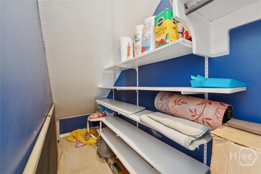 This area under the stairs provides lots of storage room for a small freezer, wine fridge, fishing gear, pool toys, and any extras.