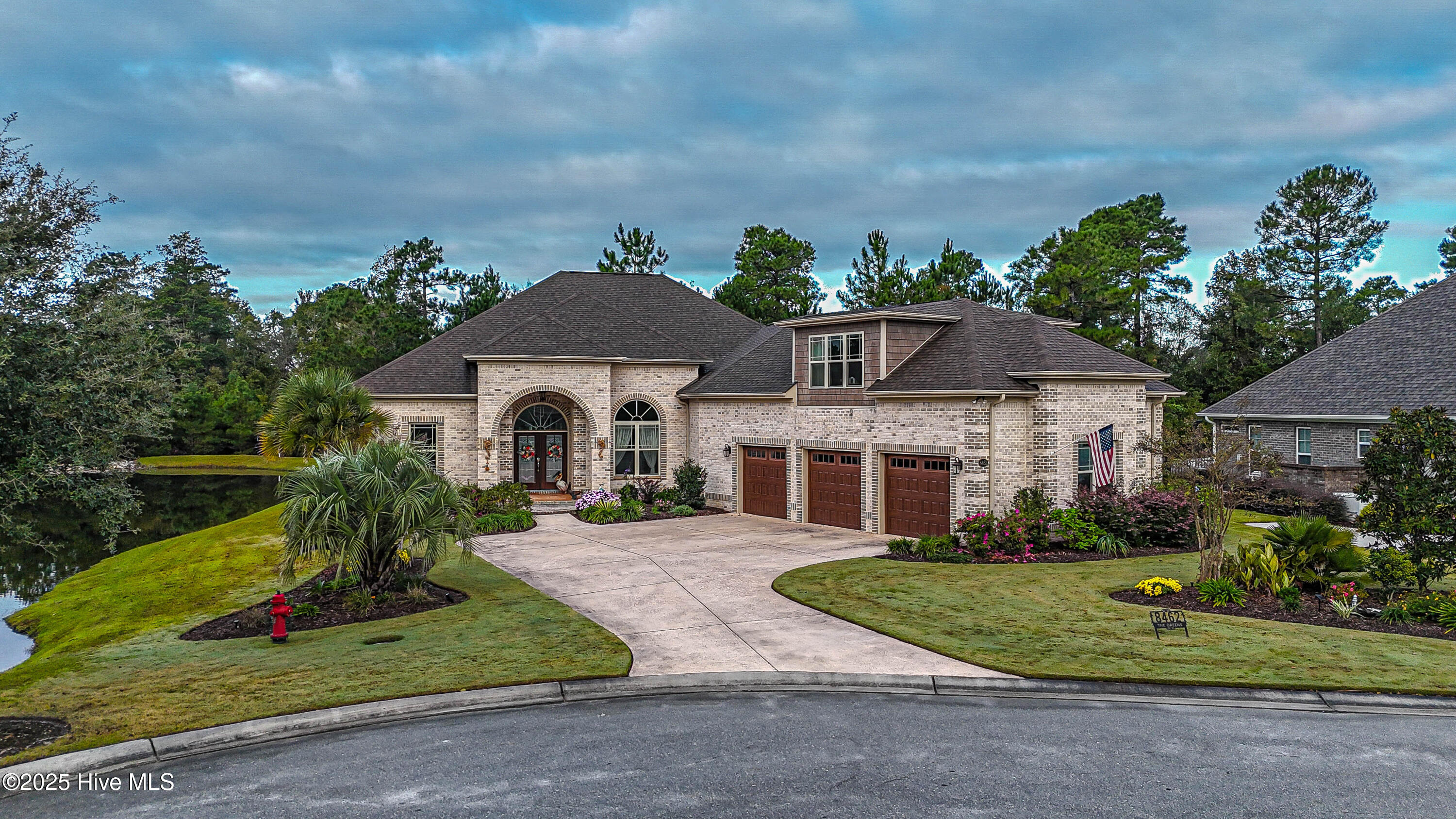 When luxury & location collide, this is what you get! Located at the end of a beautiful cul-de-sac street, overlooking a pond and nature preserve, this homesite is one of the best in all of Compass Pointe! Custom built by Liberty Homes with a 3 car garage & ample parking, this home checks every box. The moment you step through the front door, you will notice the level of detail. The dining room has soaring ceilings and the rest of the floorplan is open with lots of natural light. A generously sized living room features a fireplace flanked with bookshelves and cabinets. The chef's kitchen is nothing short of stunning with ample cabinet space and multiple serving stations and features a custom Wolf cooktop and range hood that will captivate your guests each time you host a party or family gathering. Perhaps the best room in the house is the huge sunroom overlooking the pond and nature, you will find yourself spending many hours on this porch each day. Double doors lead you to the primary suite, which has two walk-in closets, a spa-like bathroom complete with two sinks and a make-up vanity along with a custom tile shower. The bedroom is large enough to accommodate all of your furniture and also has access to the sunroom. This well thought-out floorplan has the two guest bedrooms on the other side of the house, each with their own baths. There is also a designated office on the first floor. Upstairs is a flex room that could be used as a 4th bedroom, a game room, a craft room, or workout room. There is a full bath and multiple storage areas upstairs. The list goes on and on, this house has way too many features and highlights to list, schedule your private tour to really appreciate how amazing it is! Residents enjoy state-of-the-art amenities, including a resort style outdoor pool, a lazy river, an indoor pool, a beautiful clubhouse and fitness center, a kayak lake, and miles of walk trails. Join the club for 18 holes of golf and dining opportunities.