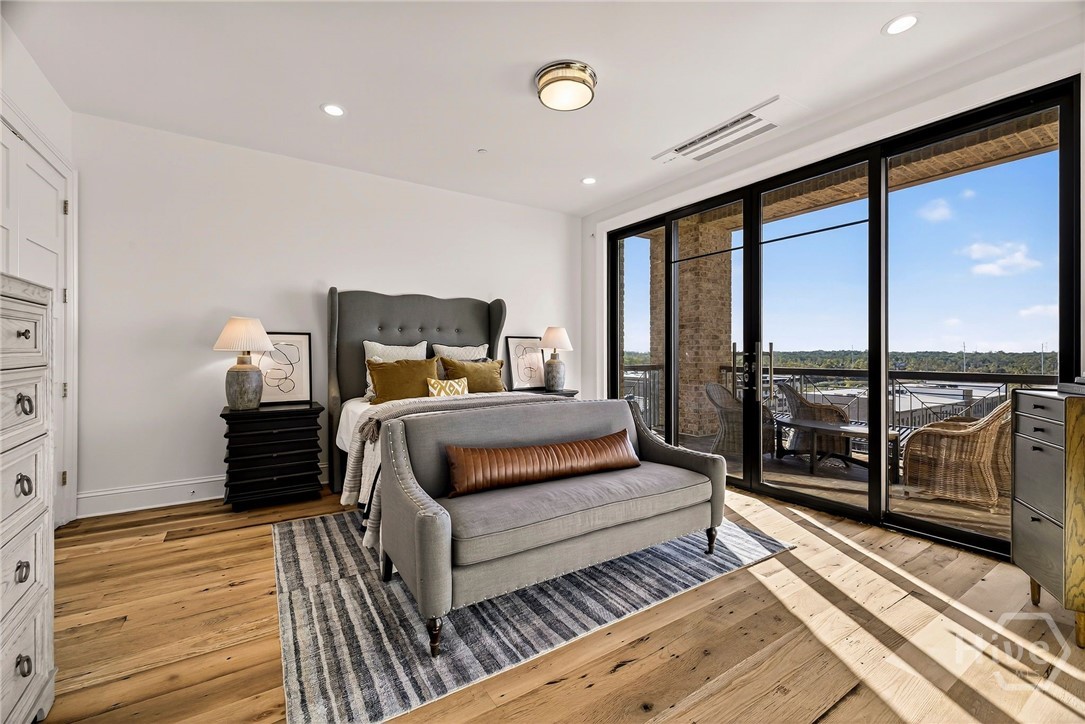 Bedroom 3 Private Balcony features a spacious layout with direct access to a private balcony, offering seamless indoor-outdoor living. Wide-plank flooring and recessed lighting enhance the room’s architectural clarity, while the glass sliding doors frame scenic views and natural light. A tranquil retreat designed for comfort and connection to nature.