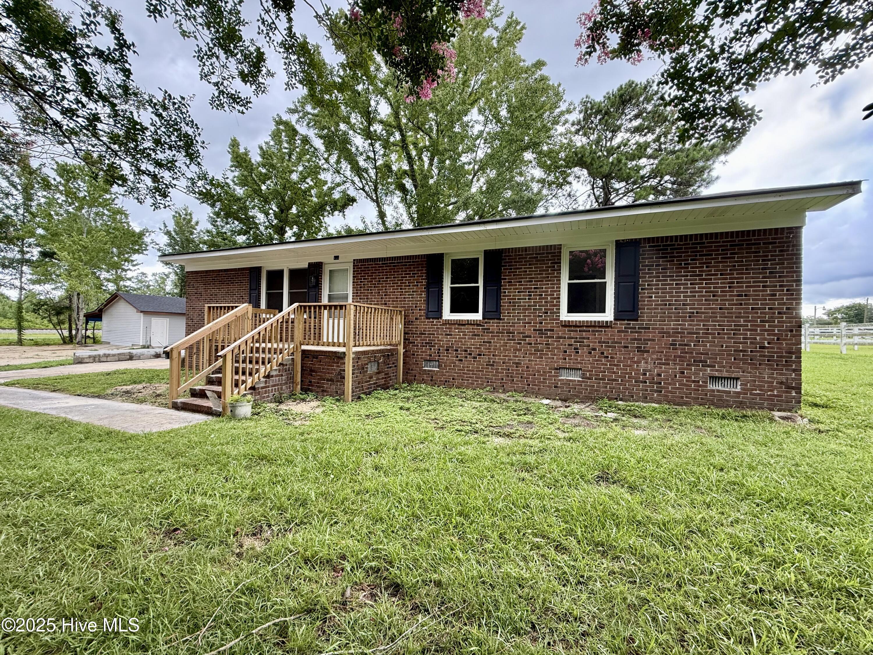 Move right into this beautifully renovated brick home nestled in the heart of Everetts, North Carolina. Every detail of this residence has been thoughtfully upgraded to offer a blend of modern style and lasting comfort. The open floor plan welcomes you with an easy flow from the kitchen to the living area, providing a bright, inviting space ideal for both relaxing and entertaining guests.
The kitchen serves as the centerpiece of the home, featuring elegant granite countertops, sleek cabinetry, and brand-new appliances designed to meet the needs of any chef. Both bathrooms have been modernized for style and convenience, including a guest bath with a step-in shower and glass doors. Throughout the home, new light luxury vinyl tile flooring adds a touch of elegance while remaining easy to maintain.
Three spacious bedrooms and two updated bathrooms ensure plenty of space and privacy for family or guests. Just outside, a generous outbuilding with a new roof and vinyl siding provides versatile storage or workshop opportunities. The property's location combines small-town charm with quick access to local amenities and neighboring communities, making daily life both tranquil and convenient.
Don't miss your chance to own this fully updated, move-in-ready home. Arrange your private showing and discover firsthand the comfort and quality that await you in Everetts.