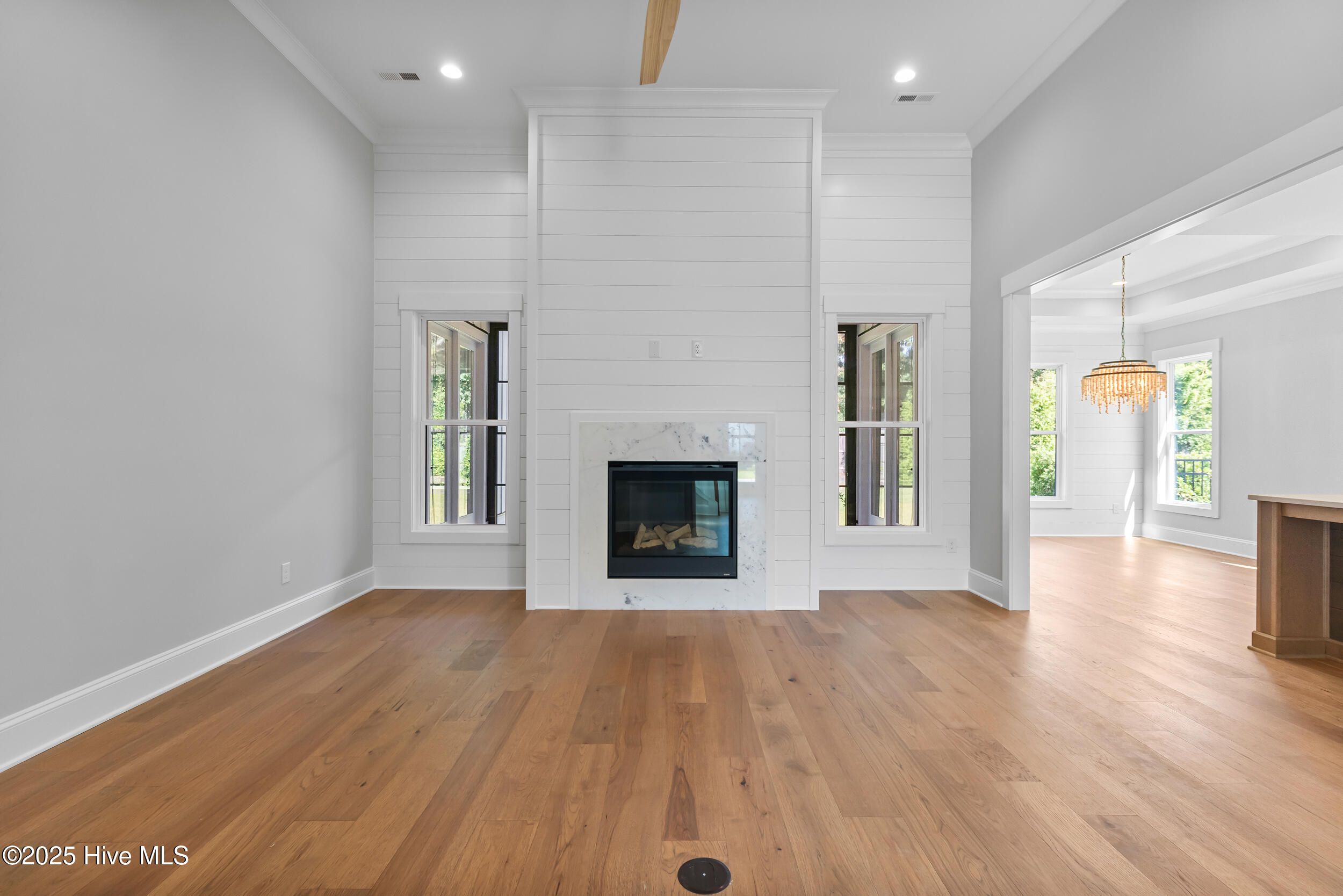 Living room with fire place and high ceilings