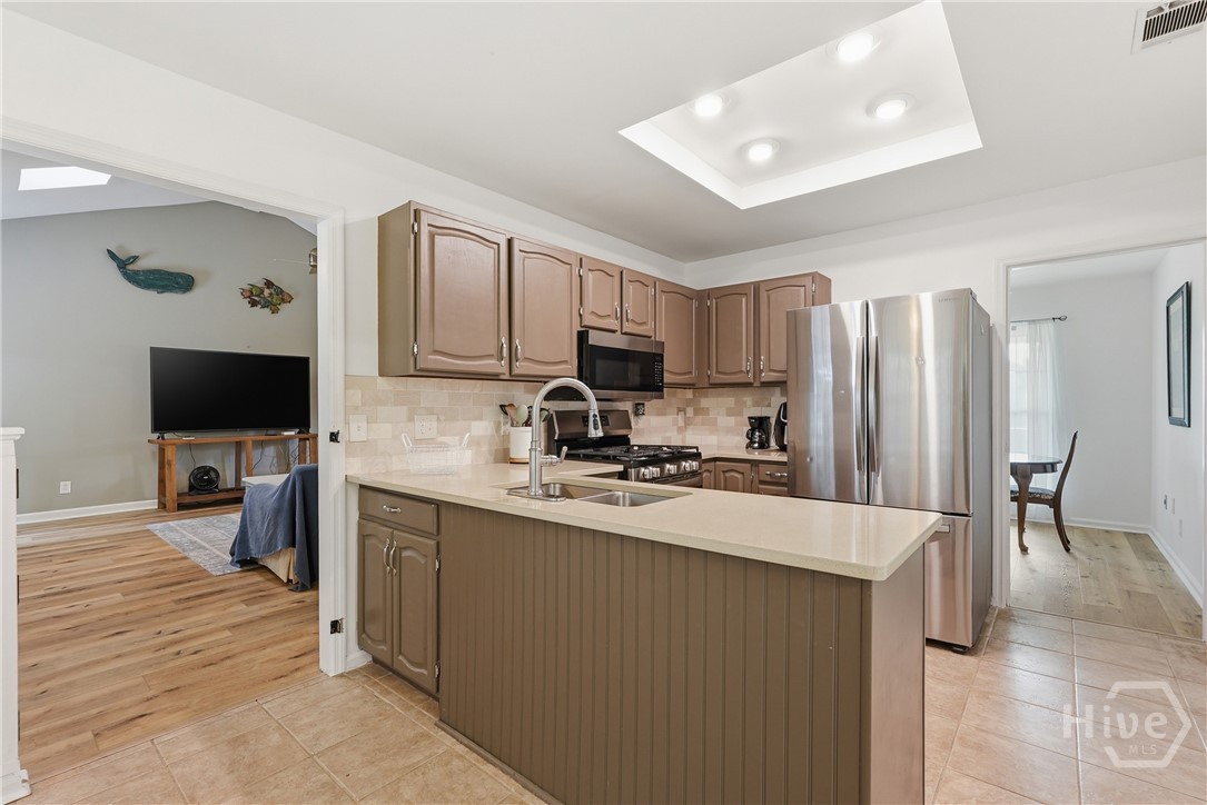 Kitchen opens to great room, dining room.