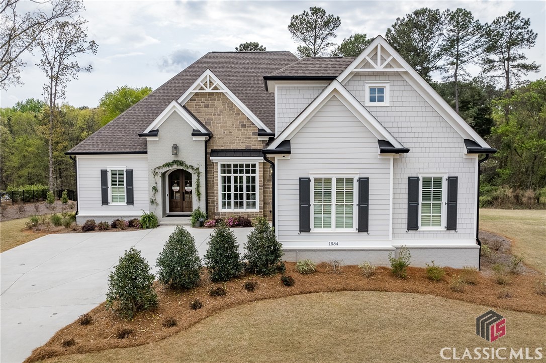 Breathtaking 1.5 Story New Construction home in Spartan Estates on a poured crawlspace with incredible curb appeal! Situated on 1.22 Acres, the builder provides high end finishes with no detail overlooked. Sought after floor plan with Master Bedroom, 2 additional bedrooms, and 2.5 baths on the main & bonus room and fourth bedroom on 2nd floor. Custom designed kitchen including oversized island and butler's pantry with antique pine doors. High end stainless appliance package including chef style 6 burner gas range. Owner's suite on main will have trey ceilings and bath with large walk-in shower with frameless shower door, and large walk-in closet. Home is finished with a professionally designed landscape package with full sod, planting plan, and zoned irrigation system.