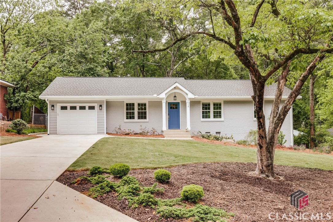Welcome to your dream home in the charming Five Points area, where modern design meets classic elegance. This impeccably renovated residence features single level living with three bedrooms and two full baths.

Meticulously upgraded to the studs in 2022, this home boasts an array of contemporary enhancements including brand new plumbing and electrical systems, seven high-efficiency mini-split HVAC units to ensure year-round comfort, a new roof, insulation, windows, doors, and sheetrock. The expansive, open floor plan is thoughtfully designed and flooded with natural light.

Step into the heart of the home: a magnificent kitchen that reveals an oversized island, providing ample storage and seating for entertaining guests. State-of-the-art stainless-steel appliances—including an internet-enabled refrigerator, range, and microwave—complete this culinary haven. Seamlessly connected, the kitchen flows into a sunlit keeping room and dining space at the front of the house, while a spacious family room awaits just off the kitchen, offering serene views of the fully fenced backyard, and access to the large rear deck.

An inviting tile-floored sunroom offers additional living space perfect for a home office, gym or additional sitting area. Outdoor entertaining is a breeze with the newly constructed deck, complete with a permanent natural gas line and string lighting.

Throughout this home, you’ll find beautiful hardwood floors and adjustable recessed LED lighting that creates the perfect ambiance. The owner’s suite is a true retreat, with a door leading to the rear deck and a wall of windows that frame picturesque views of the backyard. A custom walk-in closet provides generous storage, while the luxurious owner’s bathroom features dual sinks, a separate water closet, and a stunning frameless glass shower showcasing exquisite tile work, seating, and a linear drain.

A wonderful laundry room is located just off of the kitchen with ample storage, utility sink and a hanging rod.

For the environmentally conscious homeowner, the garage comes pre-wired for a Level 2 EV charger, and is also home to a finished storage area that is thoughtfully climate controlled, and currently used as a home gym. Ideally located within close proximity to UGA, Barrow Elementary, and the vibrant shops and restaurants of Five Points, this residence is ready for you to move in and enjoy a lifestyle of comfort and sophistication. Don't miss the opportunity to make this exceptional property your own!