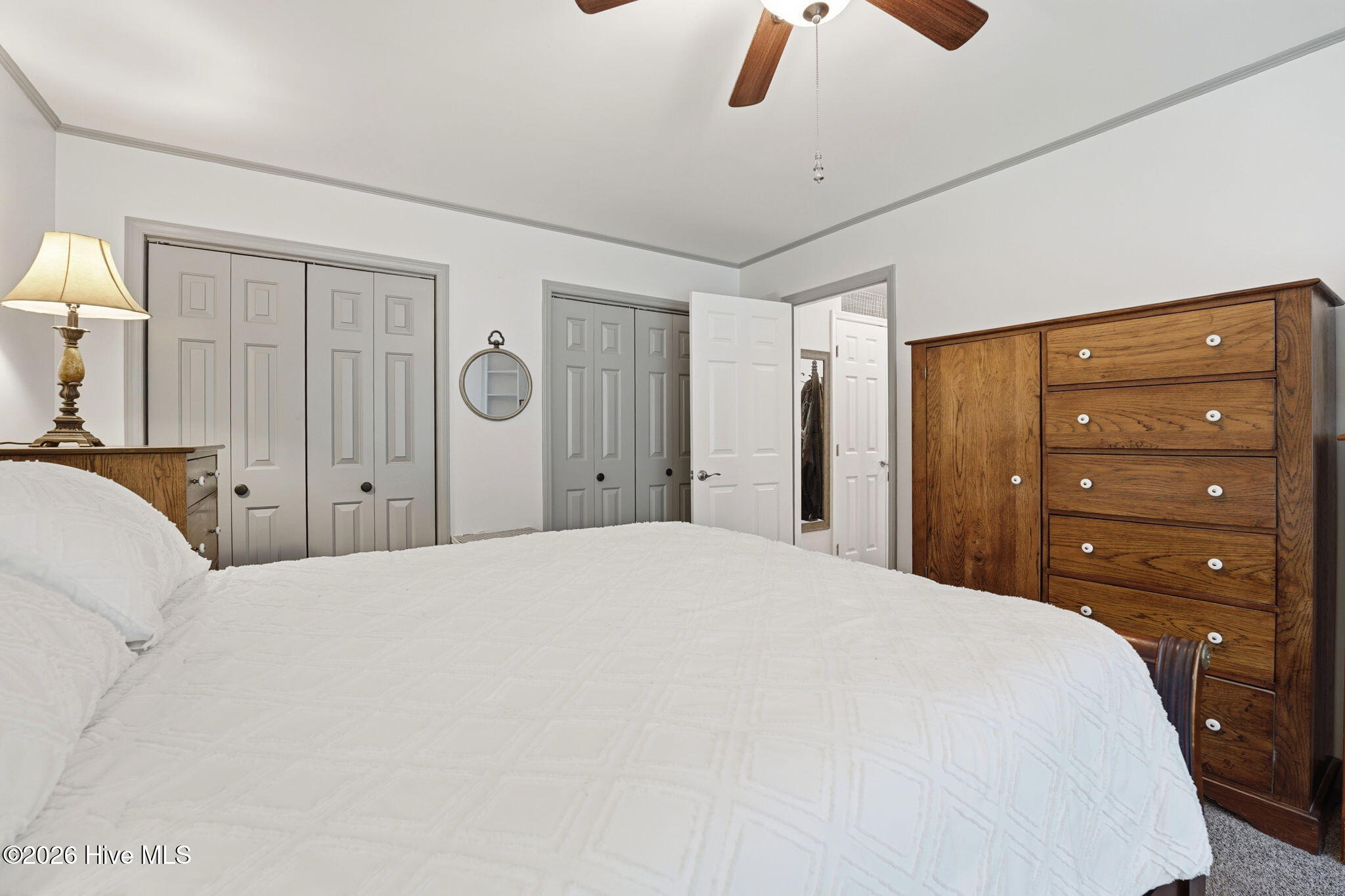 Primary bedroom with double closets.