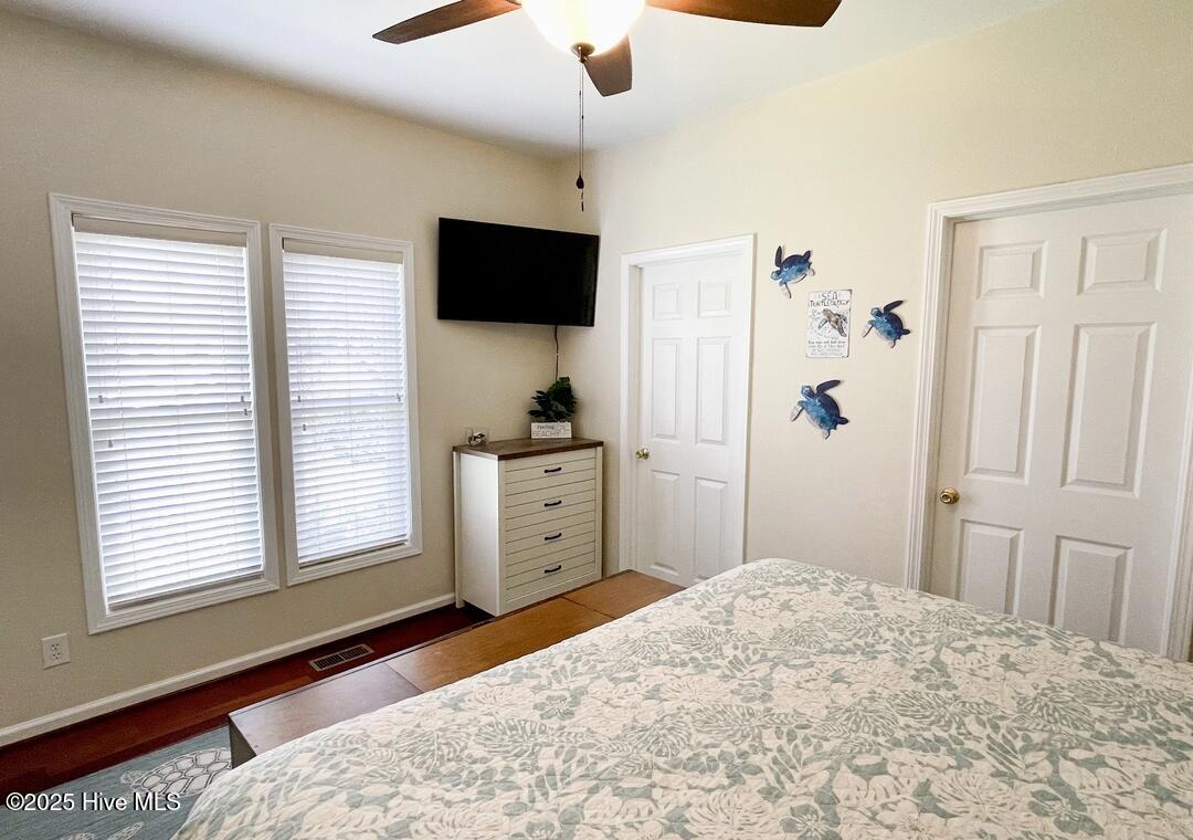 Lower Level Primary Bedroom 2 with King Size Bed and ensuite bathroom, full size W/D in walk in closet