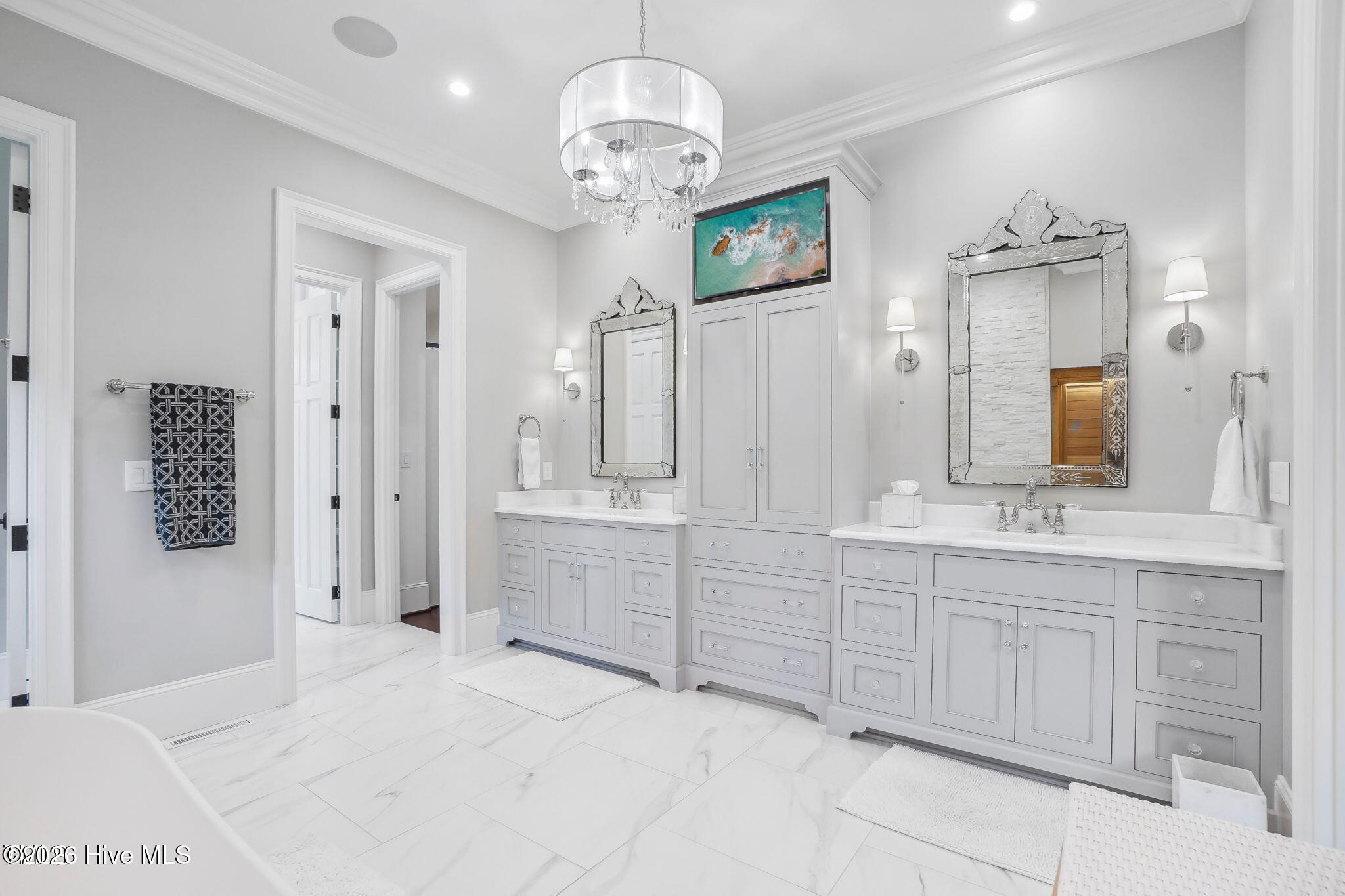 Master bathroom with white stone countertops crystal and nickel bath hardware