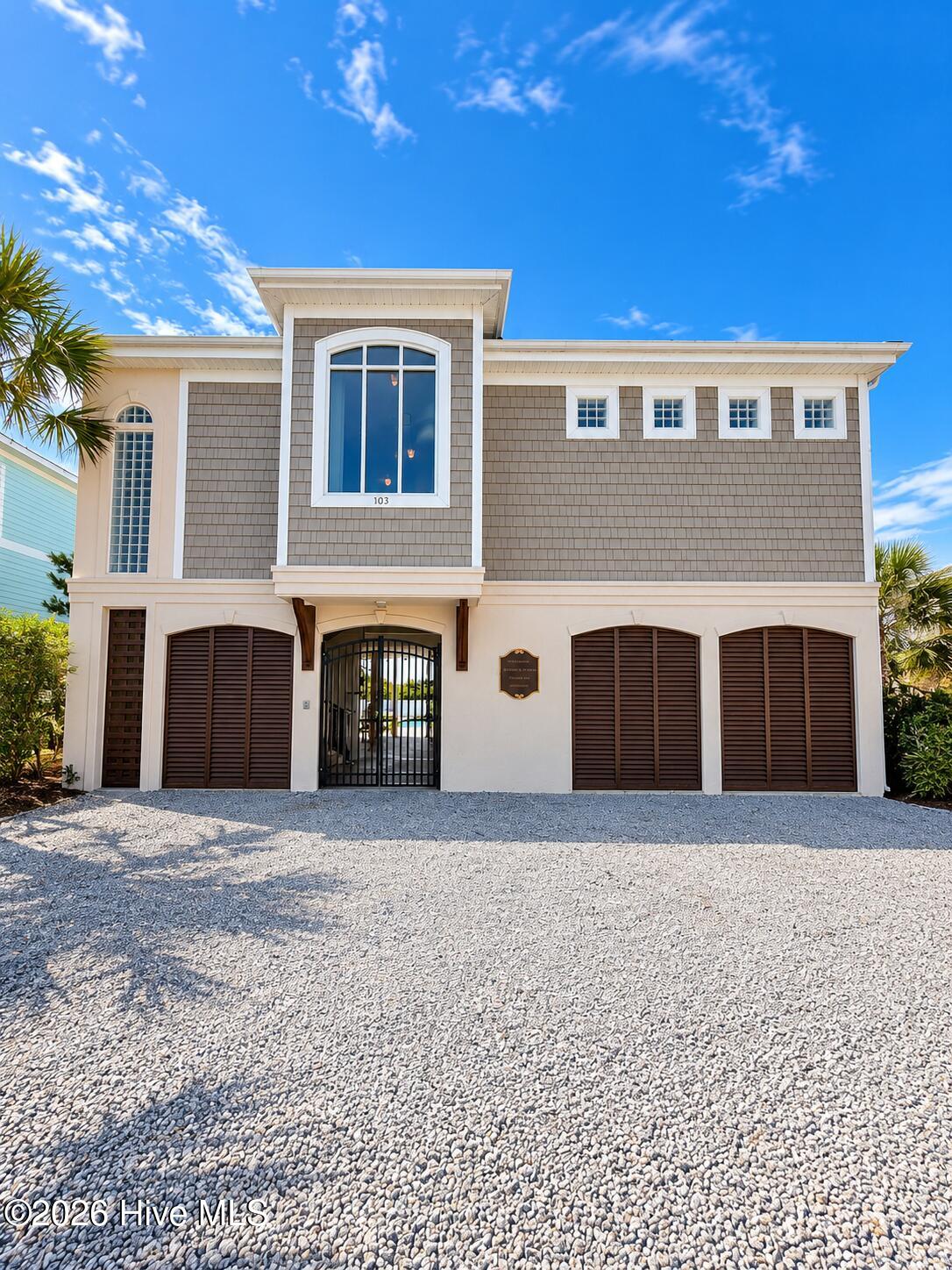 Oceanfront club house and pool with private beach access.