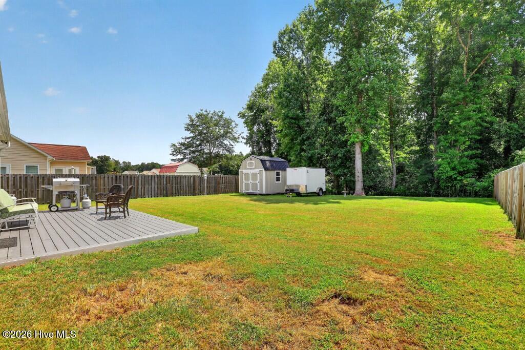 Fenced Rear Yard with Deck and Shed